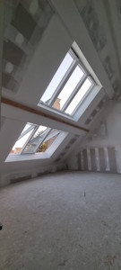 Aménagement d'un grenier à Beersel - Finition des plaques de platre dans la chambre